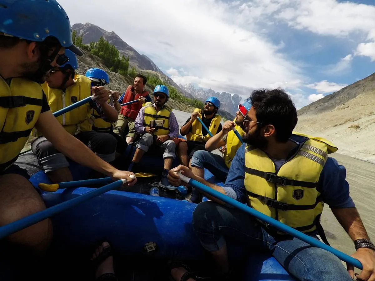 A group white water rafting on a glacial river